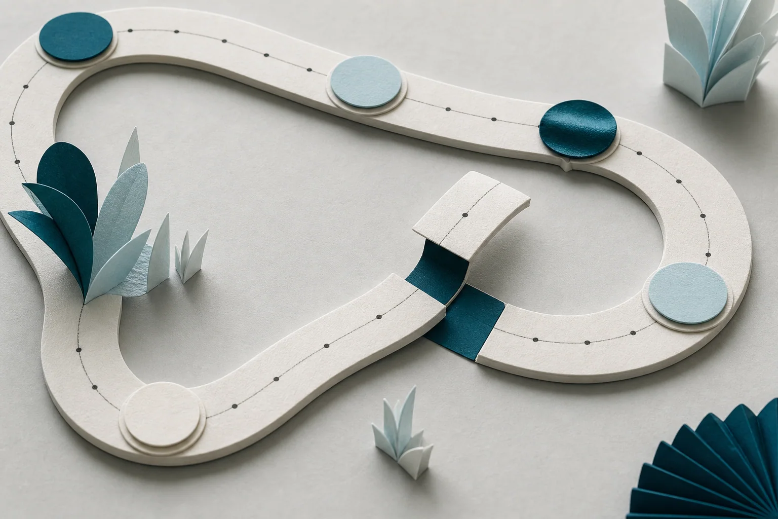 A continuous paper track with one section lifted, adjusted and rejoined
